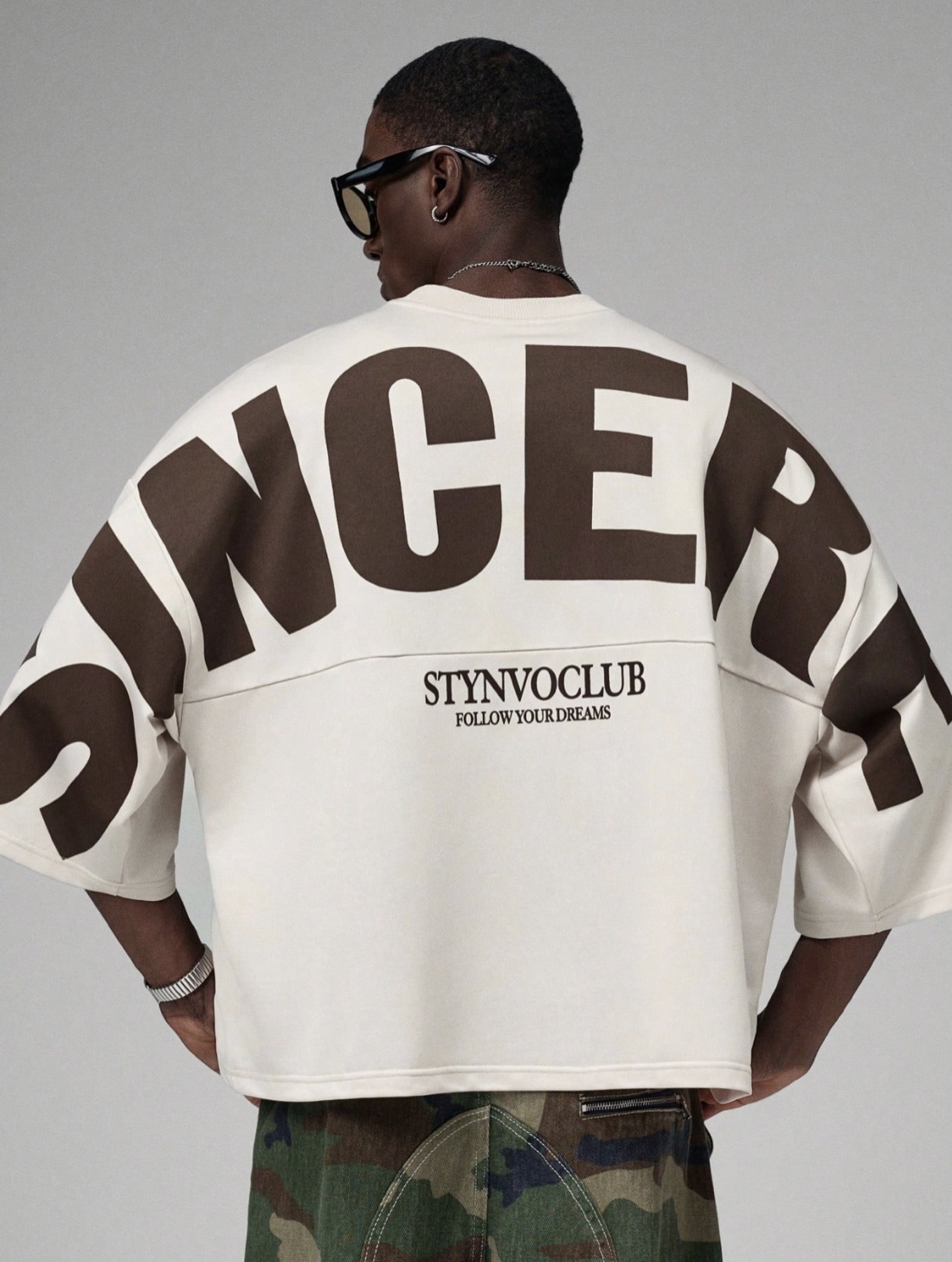 Cream wide-cut tee with giant lettering